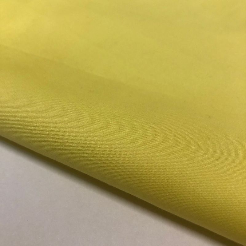 Tecido Tricoline Liso Amarelo Acetinado • Conexão Tecidos