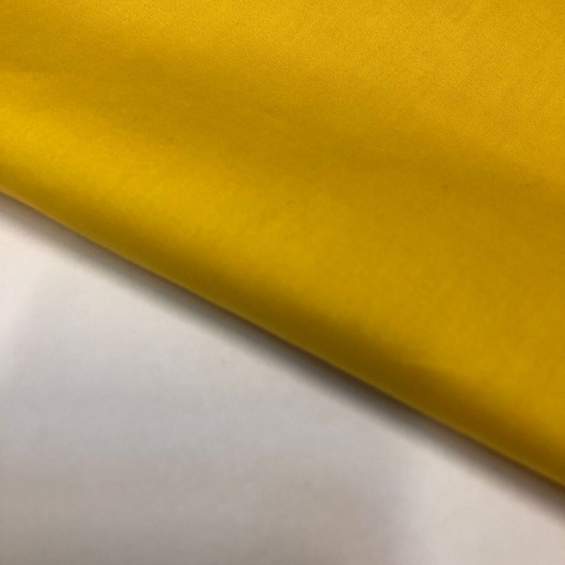 Tecido Tricoline Liso Amarelo Gema • Conexão Tecidos