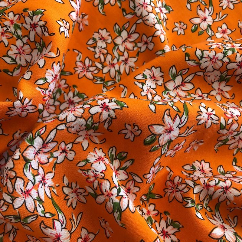 Tecido Viscose Estampada Florais Pequenos Laranja • Conexão Tecidos
