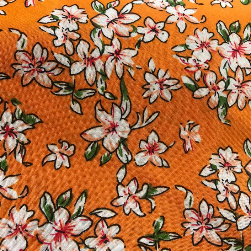 Tecido Viscose Estampada Florais Pequenos Laranja • Conexão Tecidos