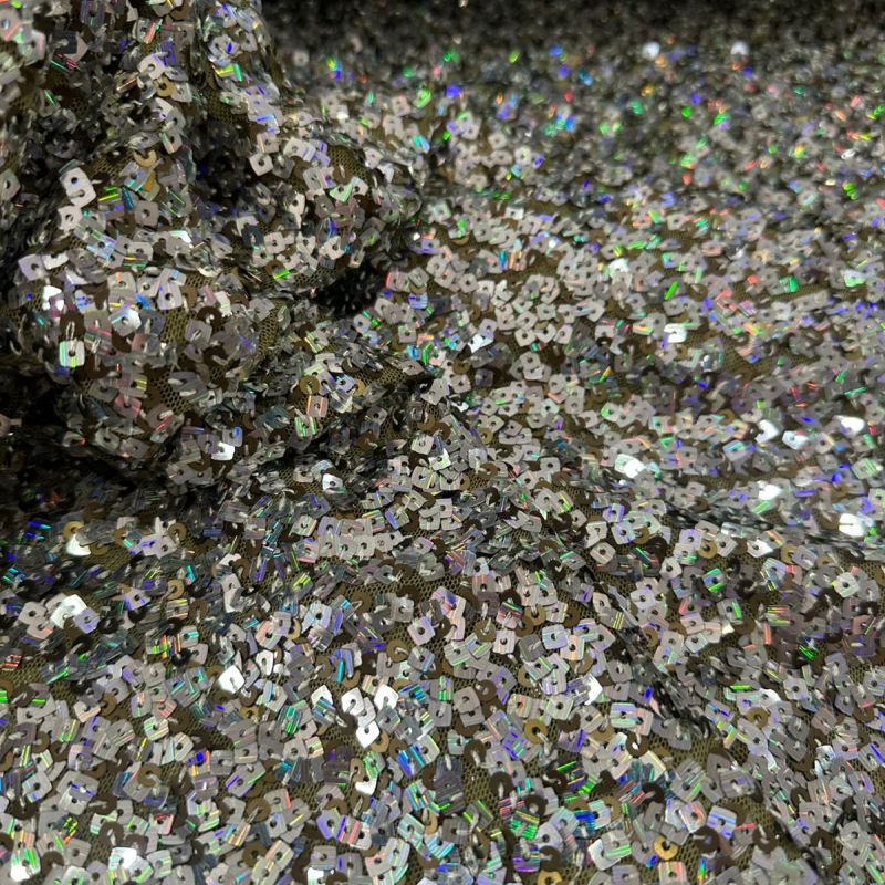 Tecido Paetê Eclipse de Prata • Conexão Tecidos